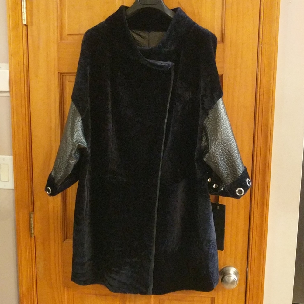 Real lambskin fur reversible coat.